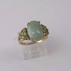 This is a 4.2 Gram 10K Yellow Gold Oval Jade Ring with Peridot Side Stones, size 7. It is pre owned but shows little if any wear.  Inventory #: R00090A Most rings are sizable for a small fee. If the ring you are considering is the incorrect size contact us for a quote. Payment Through Paypal within 3 days of purchase.   I ship to U.S addresses only. No international shipping.  Please Note: Due to a high number of returns on Items for no other reason than the buyer changes their mind or they just Jade Ring, Peridot Ring, Ring Size 7, Solitaire Ring, Ebay Store, Jade, Jewelry Rings, Ring Size, Yellow Gold