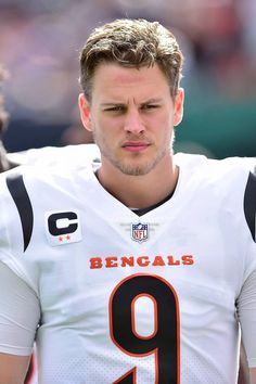 a close up of a football player wearing a uniform