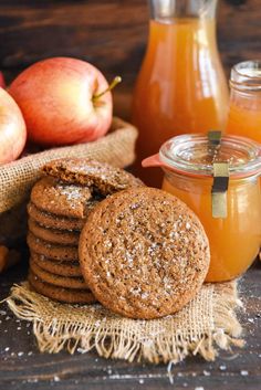 apple cider and cookies with apples in the background