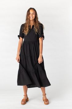 Lightweight woven swiss dot midi dress Notched neckline Short sleeves with ties Multiple gathered tiers Bodice is lined Fabric content - Cotton - Dry clean only recommended Maternity Pictures Dress, Proposal Dress, Prettiest Sunset, Wedding Getaway, Waistline Dress, Getaway Dress, Called To Surf, Tie Sleeve Dress, Mock Wrap Dress