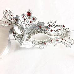 This mask captures the spirit of the clever and graceful fox, making it an ideal choice for those who appreciate its symbolism. Designed for hours of wear, it ensures you can enjoy the festivities in style and comfort. Adorned with rhinestones, this mask sparkles in the light, ensuring you'll shine bright at any masquerade ball, themed party, gala, and other events!


Age Group/Gender - Adult/Women

Size/Type - One size fits all adults

Mask Color - White/Silver

Mask Material - Polyresin/Laser White And Red Masquerade Mask, Luxury White Masquerade Mask For Carnival, Fox Masquerade Mask, Masquerade Masks For Men, Prom Masquerade, Silver Masquerade Mask, Masquerade Mask Women, Silver Mask, Metal Mask