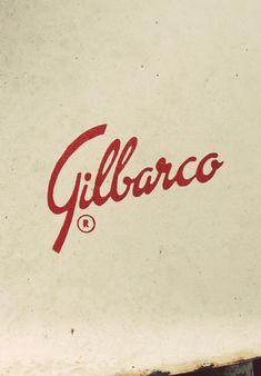 the word gulliraco is written in red ink on a white surface with rusted edges