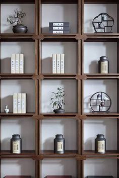 shelves with books, vases and other items on them are arranged in the shape of cubes