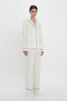 Exquisitely cut from tactile 100% silk, the Pyjama Sleep Set in nostalgic Ivory is an elevated sleepwear and loungewear option. An all-over VB house monogram print imbues the co-ord with its distinct personality, while the luxurious fabrication ensures comfort and ease of movement. The set comes with a tote bag and eye mask in a matching print. Victoria Beckham VB Monogram Pyjama Sleep Set In Ivory  - Size XL UK Monogrammed Pajamas, Sleep Set, Monogram Prints, Sleepwear & Loungewear, Outfits Ideas, Co Ord, Victoria Beckham, Eye Mask, Lounge Wear