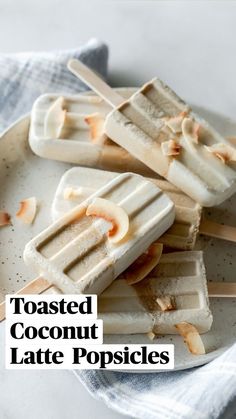 three popsicles on a plate with text that reads toasted coconut latte popsicles