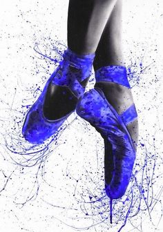 a pair of blue ballet shoes with splatters on them