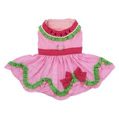 a pink dog dress with green trims and flowers on the bottom, in front of a white background