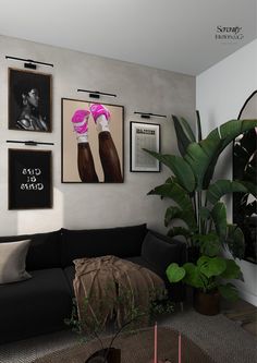 a living room filled with black furniture and pictures on the wall above it's coffee table