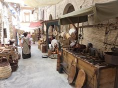 an outdoor market with lots of items on display