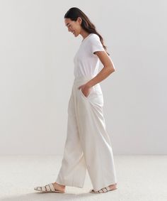 Relaxed Trouser Ivory Made from 100% textural raw silk for an effortless look that's equally polished and comfortable. With tailored pleats that seamlessly transition into a wide-leg silhouette, the Relaxed Trouser is the definition of California cool. Pair it with a classic cami or tee or embrace an oversized aesthetic from head-to-toe with your favorite lightweight knit. | Jenni Kayne Women's Relaxed Trouser Size 2 Pants With Pleats, Oversized Aesthetic, Army Pants, Relaxed Trousers, Jenni Kayne, California Cool, Effortless Look, High Rise Pants, Fitted Trousers