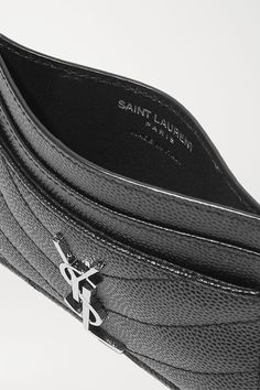 SAINT LAURENT's cardholder has been made in Italy from black textured-leather and embellished with the brand's recognizable 'YSL' plaque. It's fitted with four slots for your most-used cards and has a center compartment to hold folded receipts or tickets. Slip it inside a mini bag or clutch. Luxury Black Card Holder With Engraved Logo, Black Luxury Card Holder With Engraved Logo, Designer Leather Card Holder With Logo, Black Leather Card Holder With Engraved Logo, Designer Black Wallet With Engraved Logo, Designer Black Wallets With Engraved Logo, Black Leather Card Holder With Logo Plaque, Designer Leather Card Holder With Engraved Logo, Designer Leather Card Holder With Embossed Logo