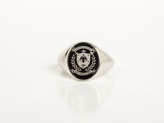 Coat of Arms jewelry - Family Crest Ring for Men ~ Customization included in purchase with your name or text on upper and lower ribbon, as preferred. Leave your note on chekcout. ✪ Classic Elegant design for men appearance with black enamel filling at face. ☛ Ring size as preferred, as it is custom created for you in our workshop. (select your ideal one in drop down menu) ☛ Custom design inside ring with your own personalized logo / pattern / symbol is possible. Contact us now! ❏ Material: ✪ Rin Classic Oval Hallmarked Enamel Ring, Oval Enamel Ring With Polished Finish As Gift, Oval Black Enamel Rings For Anniversary, Oval Hallmarked Signet Ring For Commemoration, Classic Oval Engraved Ring For Commemoration, Oval Signet Ring With Polished Finish For Commemoration, Formal Black Enamel Oval Ring, Formal Oval Black Enamel Signet Ring, Classic Oval Enamel Ring For Gift