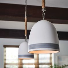 two lamps hanging from the ceiling in a room