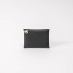 Our leather card wallet makes it simple to carry the essentials when out and about. This wallet is made from a French leather that has been finished to be waterproof so it's ready to help you take on the day no matter the weather! Easily holds 8 cards and a few bills comfortably. Carry more or less to your preference. Pair it with our key wristlet for the ultimate grab-and-go convenience without sacrificing style. Wristlet sold separately. Handcrafted in Greenville, South Carolina. Everyday Black Trifold Wallet With Smooth Grain, Minimalist Coin Purse With Interior Card Slots, Black Everyday Trifold Wallet, Everyday Black Rectangular Trifold Wallet, Everyday Black Trifold Wallet, Minimalist Wallets With Card Slots For Travel, Minimalist Travel Wallets With Card Slots, Modern Everyday Trifold Wallet With Coin Pocket, Minimalist Travel Wallet With Card Slots