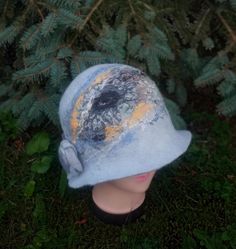 For those who want to look original in any weather, I offer a hat with a brim, handmade from felt. The hat was created by me using the wet felting method from merino wool, viscose, decorative threads and natural silk. The hat is made by hand - only wool, water and soap. A one of a kind hat and you will stand out from the crowd. The bucket hat has an original design created by me from merino wool and decorative fibers. The height of the crown of the hat is 18 cm. The size of the bucket hat is 57- Winter Felt Cloche Hat With Short Brim, Handmade Winter Bucket Hat With Short Brim, Handmade Wool Felt Hat For Winter, Handmade Cloche Hat For Winter, Unique Winter Brimmed Hat, Handmade Cloche Winter Hat, Unique Brimmed Winter Hat, Handmade Winter Cloche Hat, Blue Felt Hat For Winter