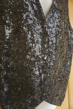 "Vintage sparkly vest with three front snap closures and adjustable tie in the back. Labeled size Large, please see measurements. In good vintage condition!! 21\" armpit to armpit across front lying flat -doubles to 42\" around 20\" across waist 23\" length" Fitted Sequin Vest For Night Out, Glamorous Sequined Vest For Night Out, Fitted Glamorous Evening Vest, Fitted Sequined Vest For Party, Fitted Sequin Vest For Parties, Fitted Sequin Party Vest, Sleeveless Evening Vest For Fall, Black Party Vest For Fall, Black Fall Party Vest