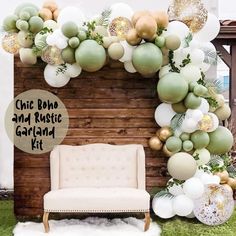 a chair sitting in front of a wooden wall with balloons and greenery on it