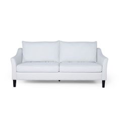 a white couch sitting on top of a white floor