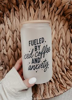 a person holding a coffee mug with the words fueled by iced coffee and an angry