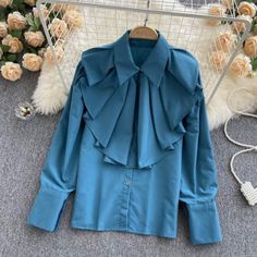 Chic Long Sleeve Solid Color Shirt, Long Sleeve Solid Color Office Tops, Chic Long Sleeve Solid Shirt, Chic Solid Long Sleeve Shirt, Blue Long Sleeve Winter Blouse, Trendy Ruffled Winter Blouse, Trendy Winter Blouse With Ruffles, Chic Long Sleeve Shirt For Party, Trendy Long Sleeve Solid Color Blouse