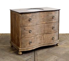 an old wooden dresser with a sink on it's top and two drawers in the middle