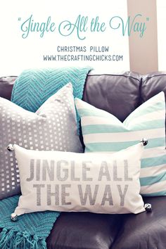 a couch with pillows on it and the words jingle all the way written in white