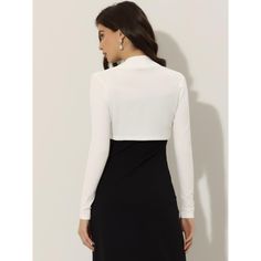 This versatile shrug is a must-have for any fashion-forward wardrobe. Its soft and lightweight knit material makes it comfortable to wear, while the long sleeves and crop length offer a chic and modern look. The clean, collarless silhouette is precisely cropped above the waist, making it the perfect cover-up for any occasion or event. You can easily pair it with a white dress or sleeveless dress to showcase your graceful gesture. With its contemporary design and effortless style, this shrug is s Solid Color Stretch Long Sleeve Shrug, Long Sleeve Spring Workwear Shrug, Elegant Open Front Winter Tops, White Stretch Long Sleeve Shrug, Chic Long Sleeve Shrug For Layering, Elegant Long Sleeve Stretch Shrug, Fitted Long Sleeve Shrug For Work, Elegant Long Sleeve Shrug For Workwear, White Long Sleeve Shrug For Fall