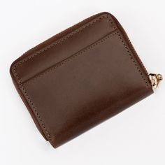 Zip Up Your Essentials in Style: The Mini Brown Leather Wallet for Women This mini zip-around wallet is crafted from smooth genuine brown leather and designed specifically for the modern woman on the go. It's the perfect blend of functionality and fashion, keeping your essentials organized and secure without weighing you down. Here's why you'll love it: Secure zip closure keeps your belongings safe and protected. Multiple card slots offer ample space for credit cards, IDs, and loyalty programs. Classic Coin Purse With Rfid Blocking For Daily Use, Classic Coin Purse With Rfid Blocking, Classic Coin Purse With Card Slots For Daily Use, Classic Compact Wallet For Daily Use, Classic Rfid Blocking Coin Purse For Everyday, Classic Brown Business Coin Purse, Classic Brown Coin Purse, Classic Compact Coin Purse With Card Slots, Classic Leather Coin Purse With Card Slots