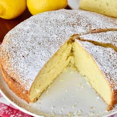 a lemon cake with one slice cut out