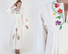 Incredible hand embroidered Mexican floral dress. Tons of colorful hand embroidery throughout bodice, skirt and sleeve cuffs. Draped shoulders with wide bell sleeves. A-line shift fit that hits near the ankles. Made of 100% off white cotton material. Dress is unlined and pulls on over the head. size estimate: S/M shoulders: 14" bust: 35" waist: 34" hips: 60" total length: 54" Model is 5'9" and measures 32" bust, 25" waist, 34" hips. Belts/accessories are not included unless noted in the descript Multicolor Long Sleeve Embroidered Dress For Wedding, Spring Wedding Dress With Embroidered Sleeves, Spring Wedding Dress With Embroidered Border, Long Sleeve Multicolor Embroidered Wedding Dress, White Long Sleeve Dress With Embroidered Border, Multicolor Long Sleeve Embroidered Wedding Dress, Folk Style Wedding Dress With Multicolor Embroidery, White Folk Style Embroidered Wedding Dress, White Folk Style Embroidered Maxi Dress