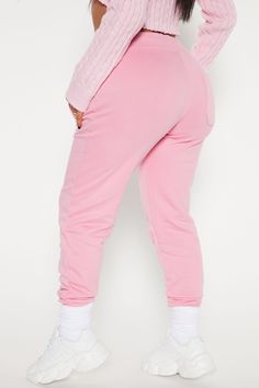 Everyone needs a pair of comfortable joggers in their wardrobe, and our pink Stole Your Boyfriend's Oversized Jogger is the perfect addition. Made with a soft cotton texture, these ankle length joggers feature cuffed hems, a high waisted rise, and straight leg shape. Complete with drawstrings for a customized fit, these joggers are perfect for a sporty look. Whether you're hitting the gym or running errands, these joggers will keep you comfortable and stylish all day. | Stole Your Boyfriend's Ov Casual Pink Cotton Sweatpants, Super Soft Cotton Sweats For Loungewear, Spring Cotton Joggers With Ribbed Waistband, Pink Cotton Sweatpants, Relaxed Fit Cozy Pink Pants, Trendy Cotton Bottoms For Loungewear, Spring Cotton Joggers For Loungewear, Trendy Cotton Loungewear Bottoms, Pink Relaxed Fit Cozy Pants