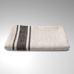 a black and white striped towel on a white background