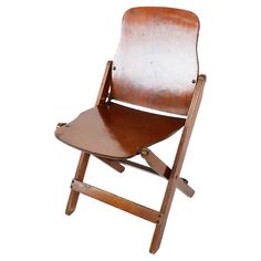 an old wooden folding chair against a white background