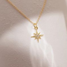 Our North Star Necklace has a classic feminine style with a delicate touch. The cluster of cz stones adds shimmer while the edges of the star create lines and depth. Layer this necklace with others to create a look that is yours alone and let the North Star be your guiding light through the day. Star-shaped Cubic Zirconia Diamond Necklace Gift, Dainty Star-shaped Diamond Necklace, Dainty Star-shaped Diamond Necklace For Gift, Star-shaped Sparkling Cubic Zirconia Necklaces, Dainty Star-shaped Cubic Zirconia Necklace, Dainty Cubic Zirconia Star Necklace, Necklaces Star, Violet Necklace, Classic Feminine Style