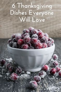 a bowl filled with powdered sugar sitting on top of a wooden table covered in snow