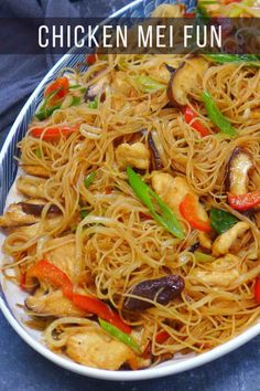 chicken and vegetable stir fry on a plate with the words chicken mee un in front of it