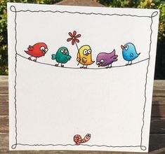 a card with birds sitting on a line