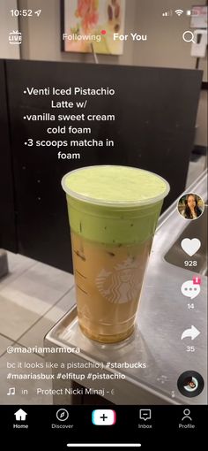 a green cup sitting on top of a counter