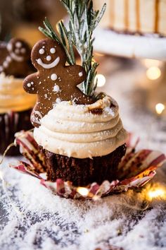 some cupcakes with frosting and decorations on them