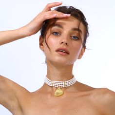 This elegant pearl choker features a gold-plated seashell-shaped pendant, making it a sophisticated addition to any jewelry collection, also perfect for summer wear. Shell jewelry Handcrafted from real sea pearls with 24k Gold plated brass seashell charm Nickel, lead and cadmium free Lobster clasp  Care To prevent oxidization and maintain long durability, keep your jewelry free of perfume, lotions, and sprays while using. It is advised to remove your gold-plated jewelry before showering. Make su Elegant Shell-shaped Pearl Drop Necklace, Luxury Pearl Choker Necklace, Elegant Pearl Shell-shaped Jewelry, Elegant Pearl Shell Jewelry, Elegant Mother Of Pearl Shell With Pearl Pendant, Elegant Gold Shell Necklace With Pearl Drop, Elegant Shell-shaped Earrings With Pearl Charm, Elegant Shell With Pearl Charm, Elegant Shell-shaped Mother Of Pearl Necklace