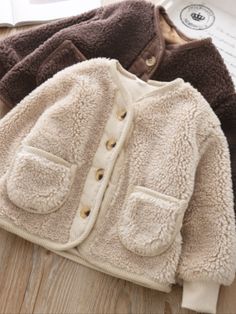 So fuzzy and adorable! Your little darling will just love cozying up in this fuzzy wool jacket that will complete her winter wardrobe. Perfect for layering over her favorite cold-weather outfits. Comfort is guranteed with its super soft fabric that’s made to provide extra warmth during chilly days. Side pocket details for storing small essentials, candies, and other treasures Perfect for fall, winter, holiday looks, and fashion photoshoots Fleece wool jacket with side pocket details Available in Outerwear Details, Sherpa Cardigan, Denim Baby, Winter Outfits For Girls, Warm Cardigan, Clothes For Girls, Soft Jacket, Korean Boys, Girls Cardigan