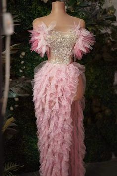 Enchanting Pink Ruffled Gown with Embellished Bodice and Feather Accents Pink Feather Prom Dress, Pink Tulle Evening Dress, Pink Feather Trim Wedding Dress, Luxury Whimsical Pink Tutu Dress, Pink Feather Dress Couture, Elegant Pink Ruffled Tulle Fabric, Pink Flower Dress, Prom Dresses Elegant, Ruffle Bodycon Dress