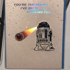 a star wars themed card with a laser light coming out of it's back