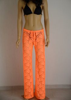 Neon orange crochet lace beach bell bottoms I created this crochet lace beach pants from quality lace.This neon orange beach cover up pant is perfect for summer beach time or going out. You can wear this crochet lace bell bottoms with heels or flip flops during the day or for evening. You have a chance to choose plus size and color during the purchasing.. SIZE CHART WOMEN PANTS; XS (0) S(0-2) M(4-6) L(8-10) XL(10-12) Waist (inches) XS (23-24) S (25-26) M(27-28) L(28-29) XL(31-32) Hips(inches) XS Fitted Crochet Lace Bottoms For Beach, Summer Festival Bottoms With Crochet Lace, Fitted Lace Beachwear Bottoms, Summer Lace Stretch Bottoms, Fitted Cotton Pants For The Beach, Fitted Crochet Lace Bottoms For Vacation, Fitted Cotton Pants For Beach, Fitted Cotton Pants For Vacation, Fitted Cotton Beach Pants