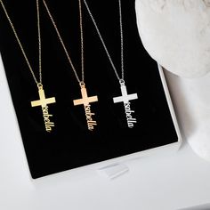 "Discover the elegance of our 14K Solid Gold Cross Necklace, thoughtfully designed to add a personalized touch. Through its unique craftsmanship, your precious name takes a graceful position at the cross's pinnacle. As a Tiny Cross Necklace, it emerges as a heartfelt gift, echoing sentiments of love, devotion, and individual essence. PRODUCT DETAILS * Material: 14K Solid Gold (real solid gold, no gold-filled or no gold plated material) * Choice of Gold Color: Yellow Gold, Rose Gold, White Gold * Closure: Spring ring * Chain style: Cable * Style: Minimalist Thinking of gifting? Elevate your order with our Christmas Gift Wrap option! 🎁 Buy from here! https://www.etsy.com/listing/1580219719/ M O R E F R O M U S Mionza Jewels' pieces are handcrafted by 30 years of experienced craftsmen and ma Affordable Personalized Cross Necklace Gift, Custom Name Necklace In White Gold, Custom Name White Gold Necklace For Gift, Elegant Customizable Necklace For Birthday Gift, Silver Cross Pendant Necklace For Personalized Gift, Customizable White Gold Necklace For Personalized Gift, Customizable White Necklace For Anniversary, Silver Name Necklace With Cross Shape, Silver Cross Necklaces With Name Detail