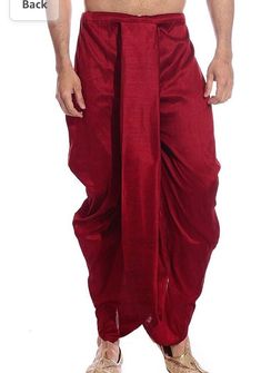 Silk dhoti for Indian ethnic wear like sherwani, kurta , etc. Material: silk Colour : Marron and red and mention if need to be customise in some particular colour Dhoti size : free size Pattern type : predrape (Solid) Waist band : elastic (fits all size ) Care: dry clean purpose only Customise available Festive Harem Kurta For Eid, Festive Eid Harem Kurta, Traditional Eid Bottoms With Drape, Traditional Drape Bottoms For Eid, Bollywood Style Festive Bottoms With Traditional Drape, Navratri Harem Kurta, Festive Navratri Harem Kurta, Traditional Harem Pants With Festive Drape, Traditional Fitted Harem Pants