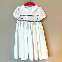 Gorgeous Ralph Lauren Hand Smocked Sailor Dress With Peter Pan Collar, Lined Skirt, Anchor Hand Embroidering And Anchor Buttons At Back. Some Minor Spots And Discoloration That Is Hardly Noticeable And Possibly Removable. Perfect For A Dressy Occasion Or Christening. Dress With Peter Pan Collar, Smocked Baby Dresses, Hand Smock, Sailor Dress, Lauren White, Ralph Lauren Dress, Sewing Project, Pan Collar, Peter Pan Collar