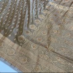 We have a major varieties of colour and design available, but due to heavy demand we may not be able to provide the exact colour and design of your choice instantly. So please inquire before ordering, if the colour of your choice is not available at stock then we will provide you with different designs with similar colour combination. pure handloom katan  Banarasi saree in India beige high demand colour. Semi-stitched Gold Banarasi Silk Traditional Wear, Gold Traditional Drape In Raw Silk, Gold Tussar Silk Lehenga With Dupatta, Gold Lehenga With Dupatta In Tussar Silk, Gold Katan Silk Traditional Wear With Zari Weaving, Gold Tussar Silk Lehenga With Zari Work, Gold Saree With Cutdana In Traditional Drape, Gold Banarasi Silk Lehenga For Festive Occasions, Traditional Gold Saree With Cutdana