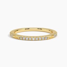 a yellow gold wedding band with rows of diamonds