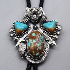 Don't even think about taking the turquoise from him. The " Turquoise Guardian " bolo tie is freshly from my bench. It is made of sterling silver and set with Roystone and high-quality Number Eight Turquoise. This cord is  23" long, and the bolo is 2.5" x 3" Blue Handmade Bolo Tie Gift, Artisan Turquoise Bolo Ties For Gifts, Handmade Turquoise Bolo Ties As Gifts, Handmade Turquoise Bolo Tie As A Gift, Handmade Sterling Silver Bolo Tie As Gift, Handmade Southwestern Turquoise Bolo Ties, Artisan Turquoise Bolo Ties With Concho, Adjustable Turquoise Bolo Tie For Gift, Turquoise Bolo Tie For Gift